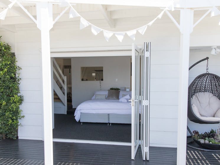 White Beach Cottage - Master bedroom opening up onto the deck