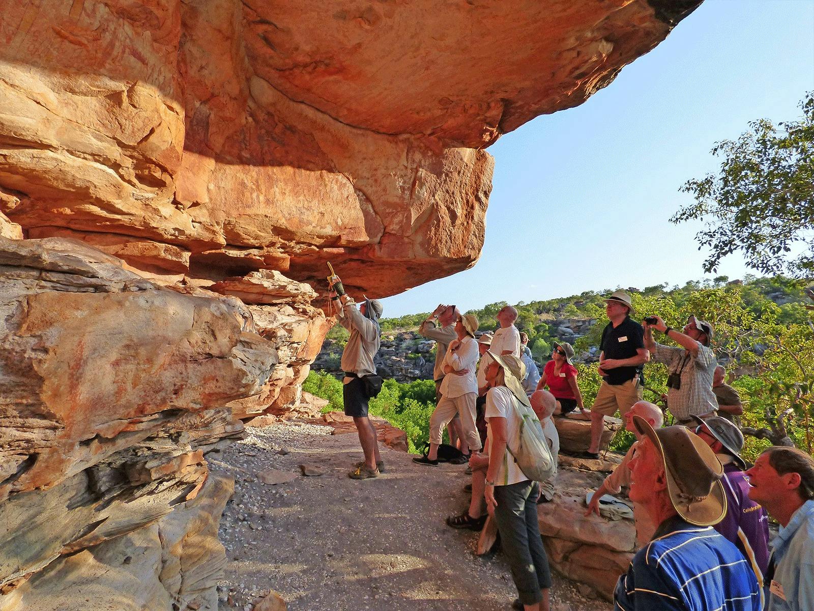 Guest Lecturer Showing Guests Ancient Rock Art At Swift Bay