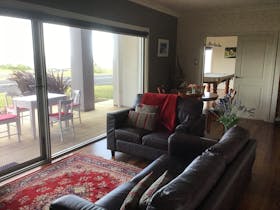 Lounge, dining room looking through to the pool room