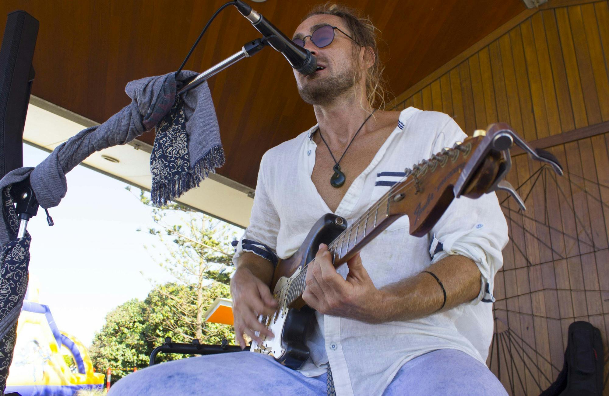 Musician playing guitar at the markets
