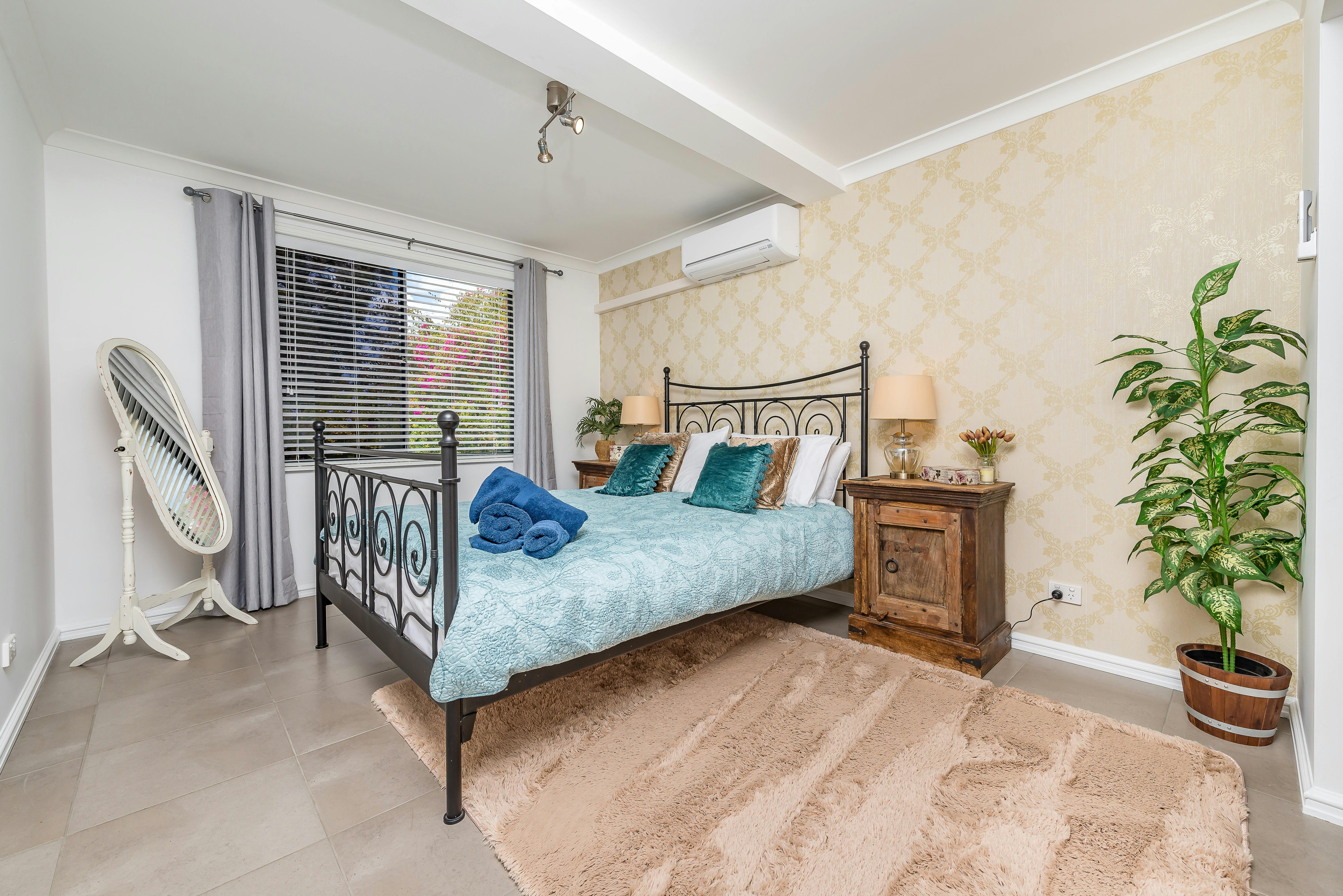 Queen bedroom 1 with reverse cycle air con/heating