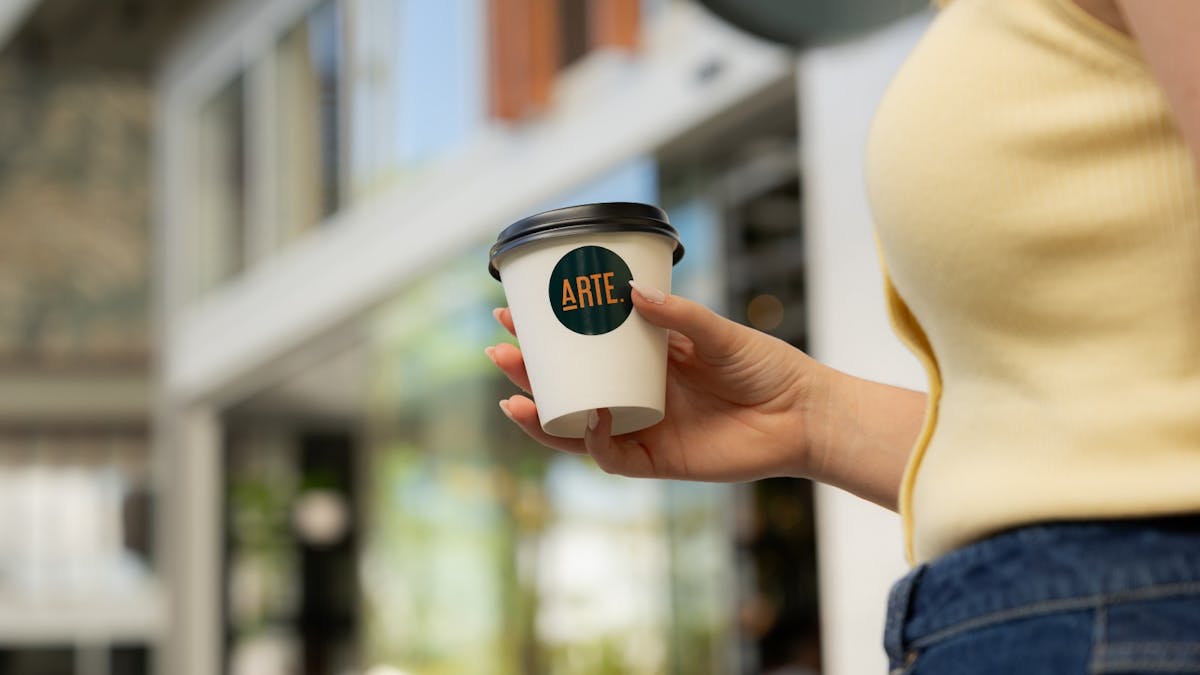 Woman holding coffee cup