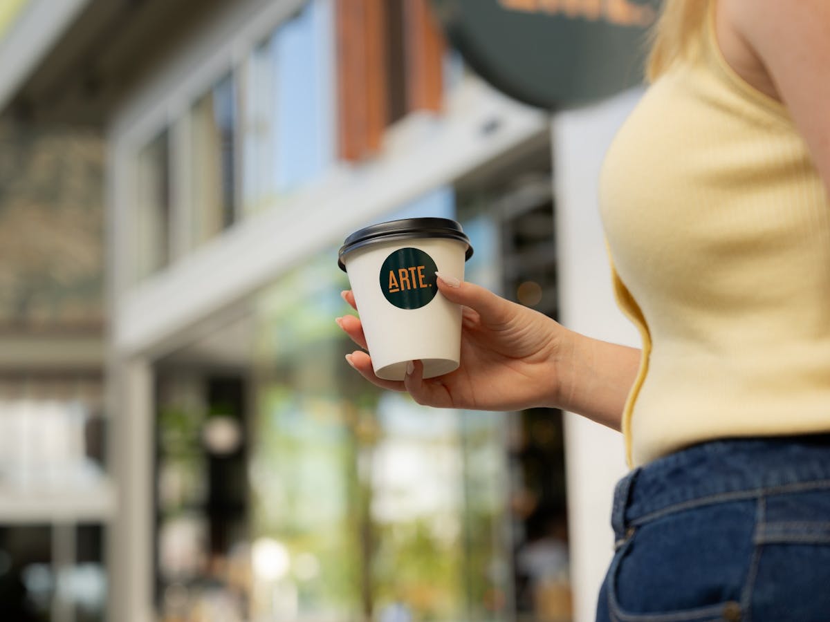 Woman holding coffee cup