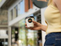 Woman holding coffee cup