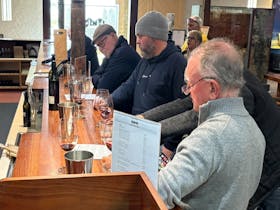 Golfers enjoying a well earned day off with wine tasting at Wynns Coonawarra Estate.