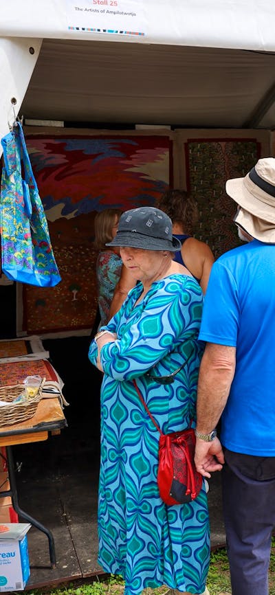 Buyers looking at artwork at the AIATSIS Indigenous Artwork