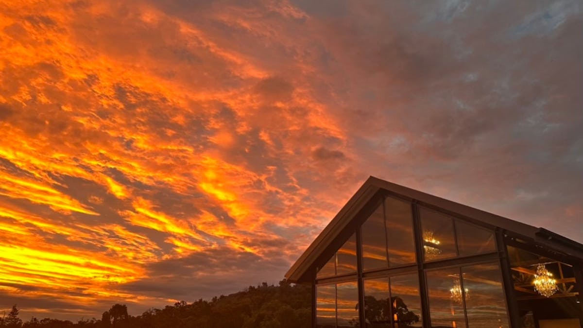 Sunset over Balancing Heart Vineyard Deck
