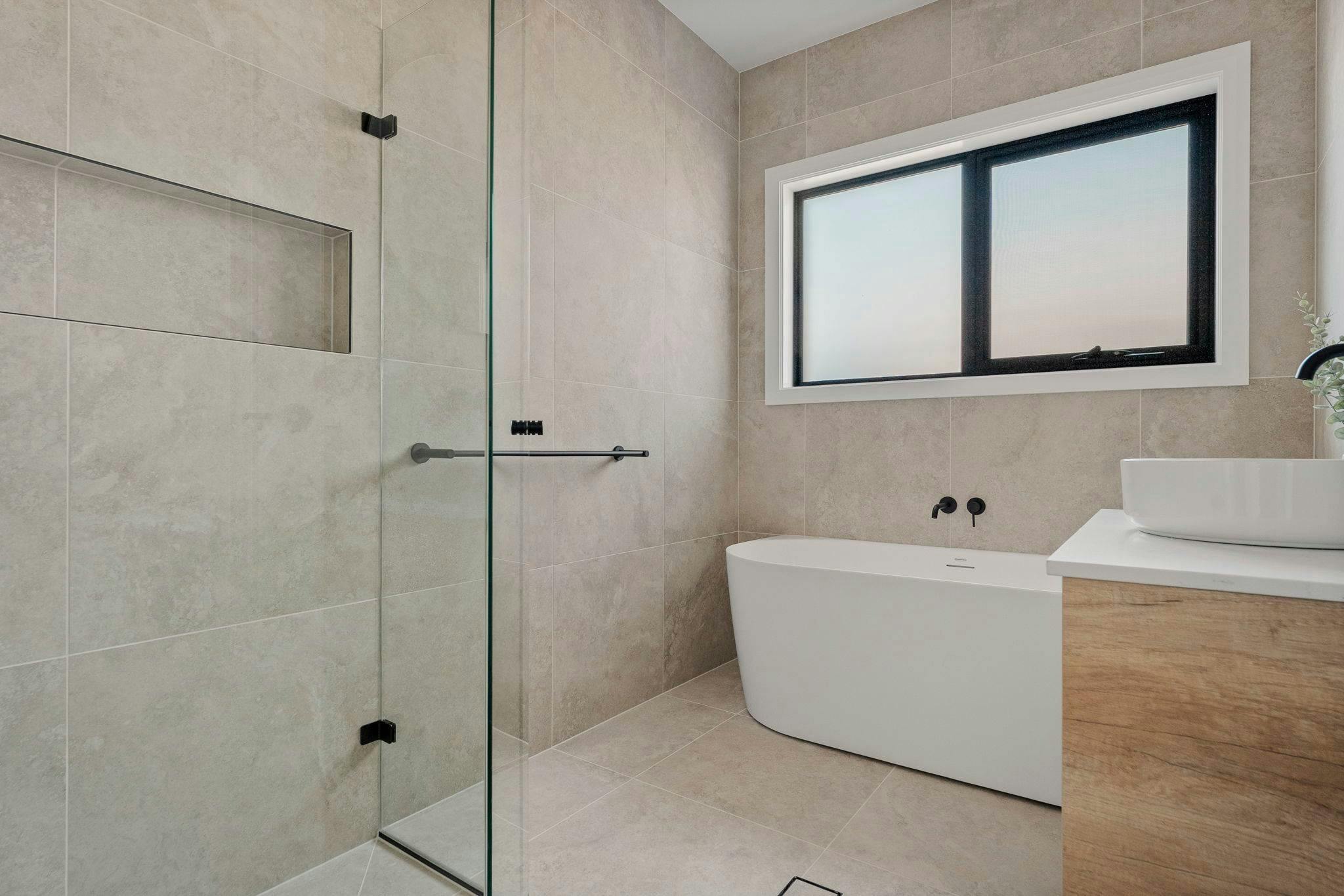 Bathroom with bath, shower and vanity.