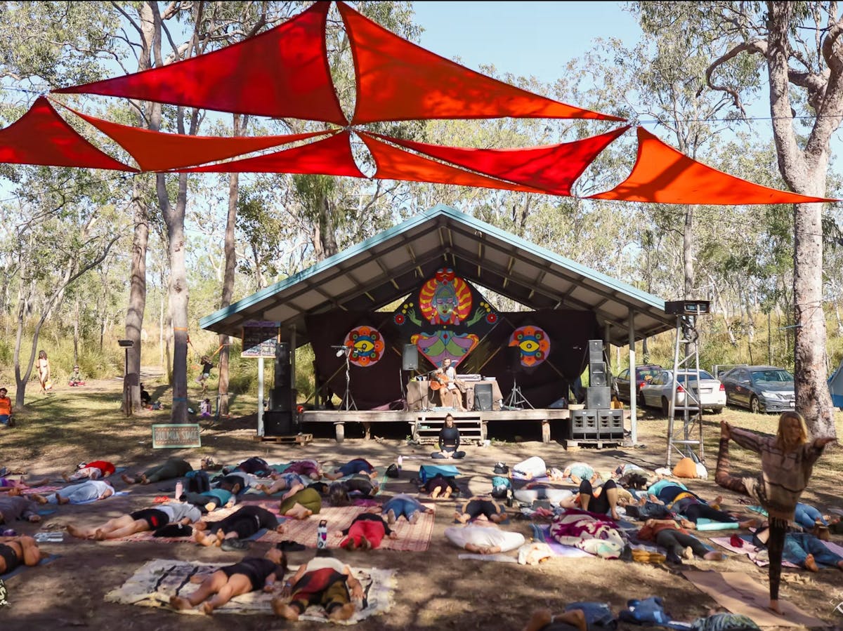 A yogi leads a group in a session at the Kuranda Roots Festival in Mareeba, FNQ.