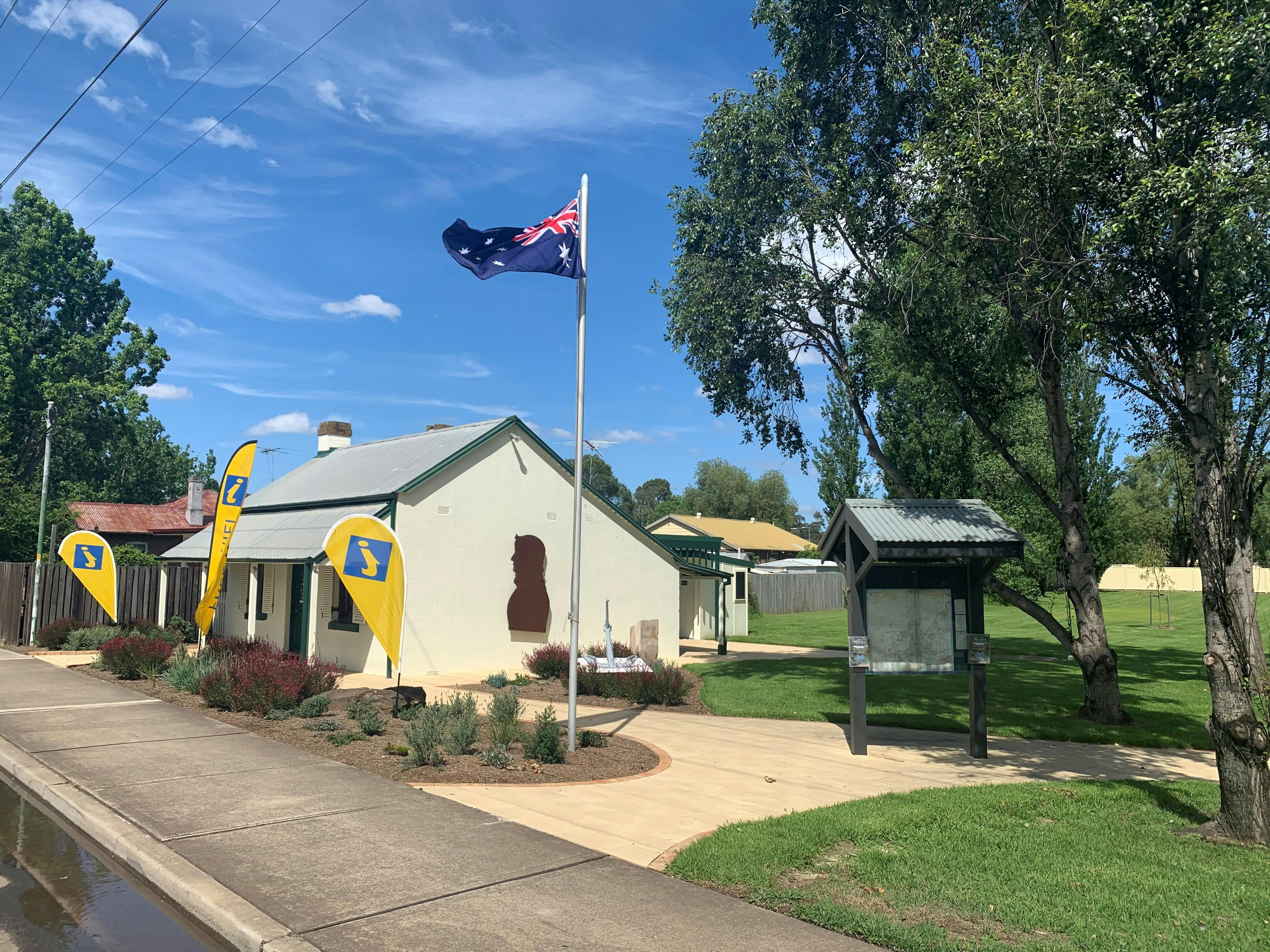 Small cottage with information flags