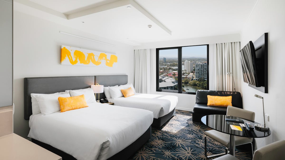 Superior twin bed with river and hinterland views
