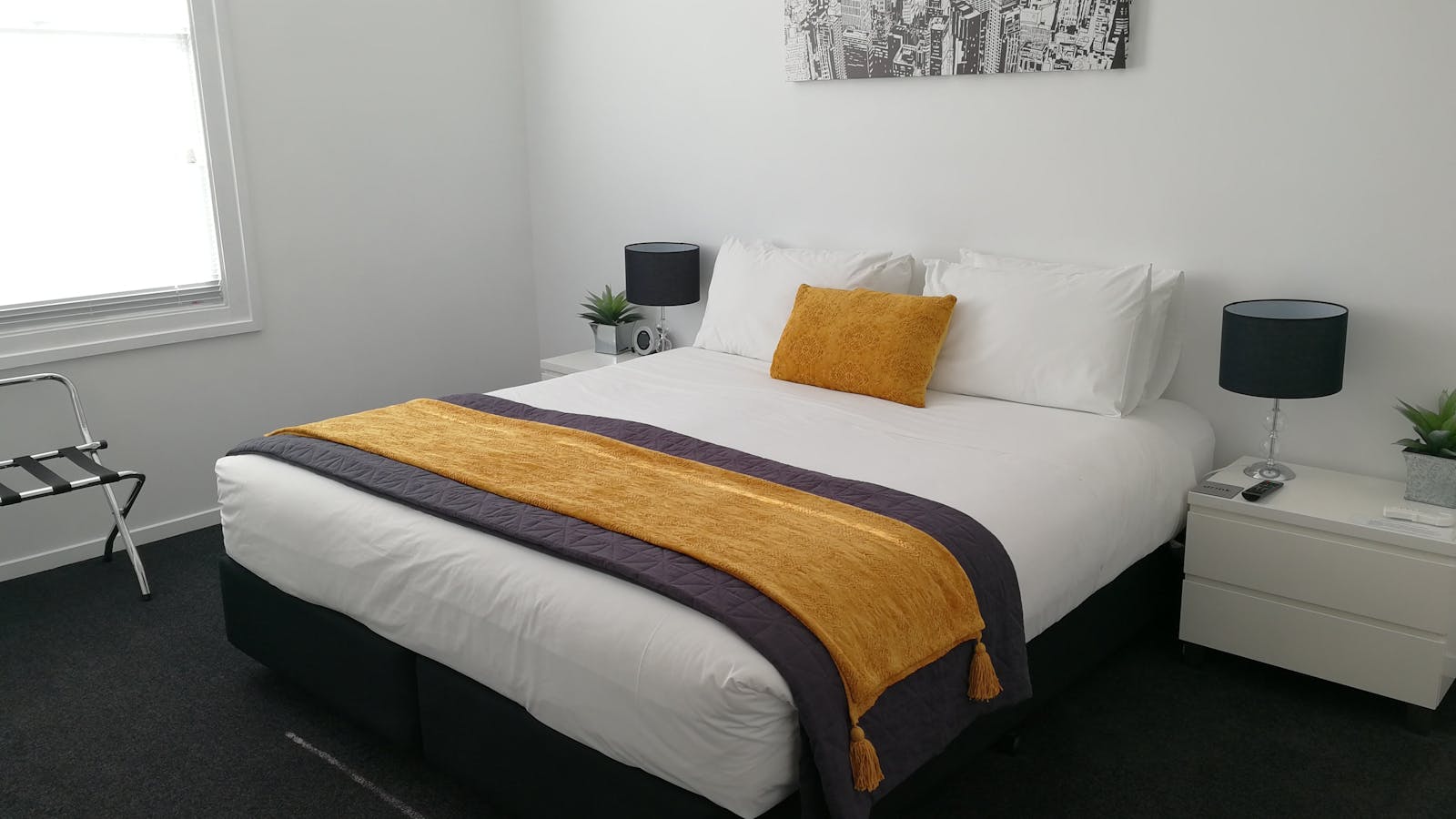 Main bedroom configuration: king bed (shown) or two single beds. Port-a-cot or rollaway can be added