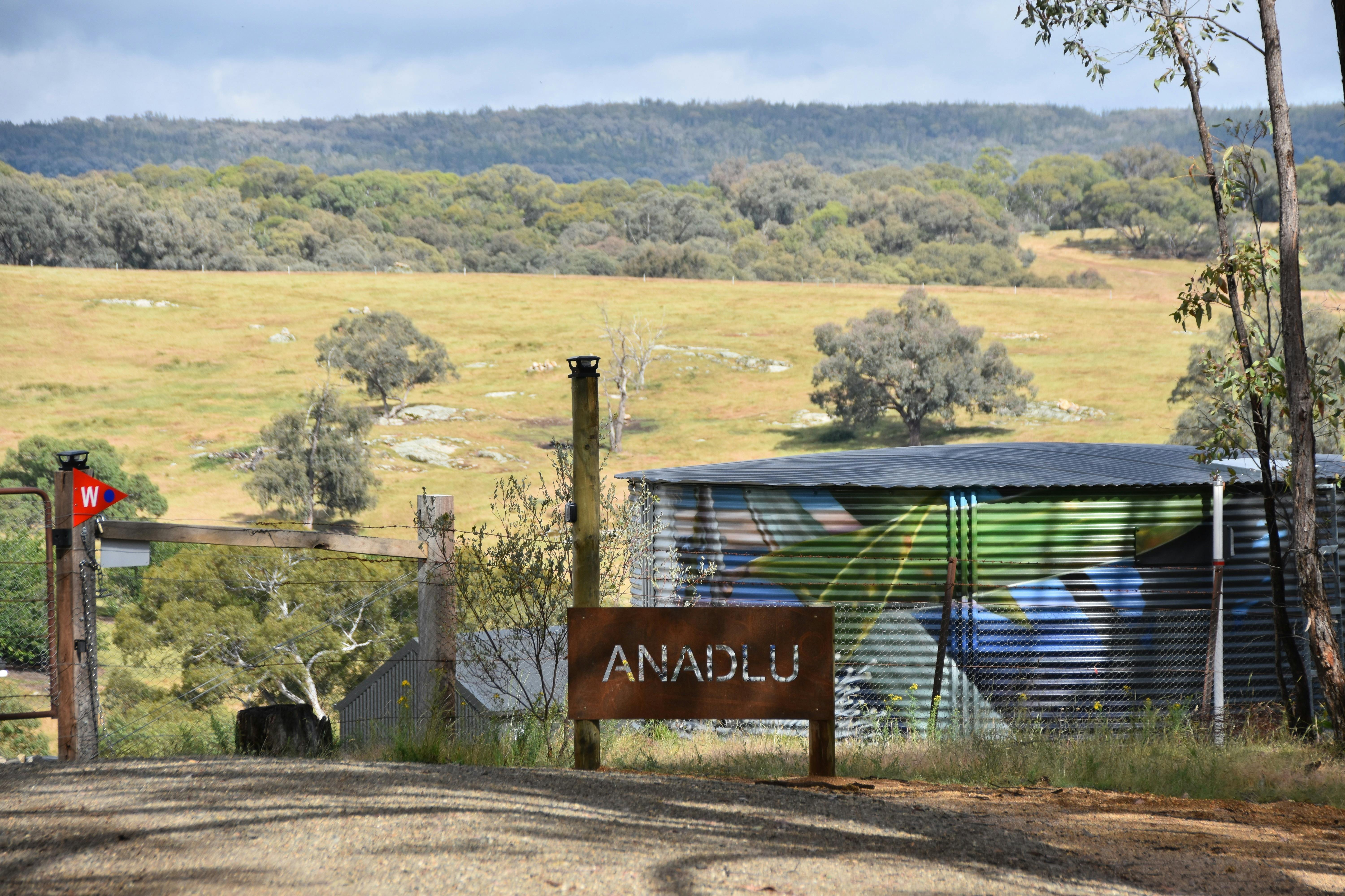 Entrance signage marking arrival at the property.