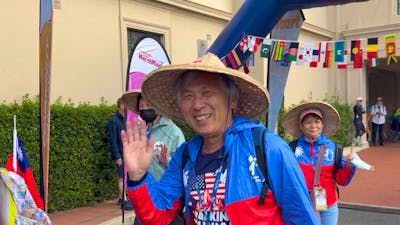 Taiwanese man waving at the start
