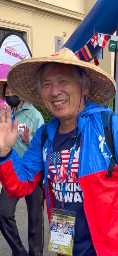 Taiwanese man waving at the start