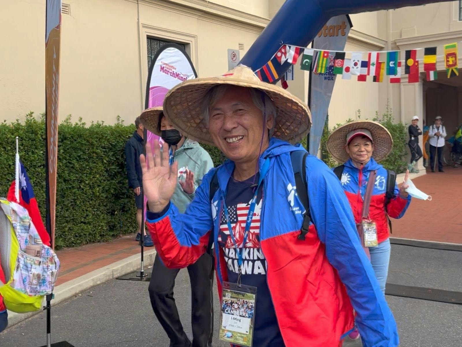 Taiwanese man waving at the start