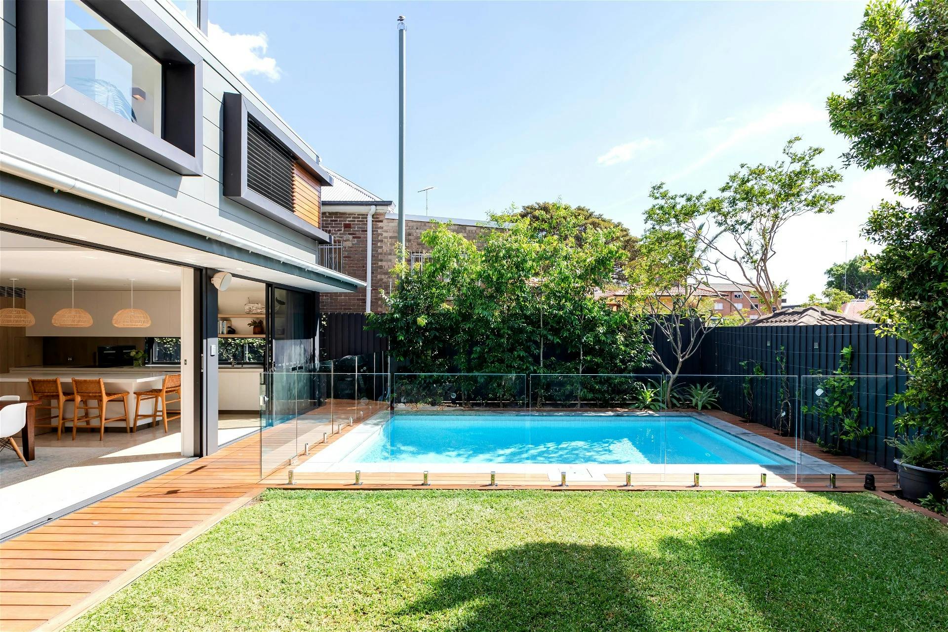 large glass sliding doors and tranquil views of the pool encourage a slower-paced lifestyle