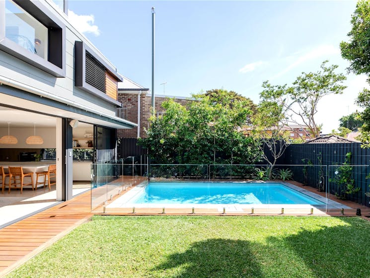 large glass sliding doors and tranquil views of the pool encourage a slower-paced lifestyle