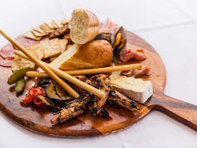 Share an antipasto plate in the Rye Hotel Cafe or alfresco dining