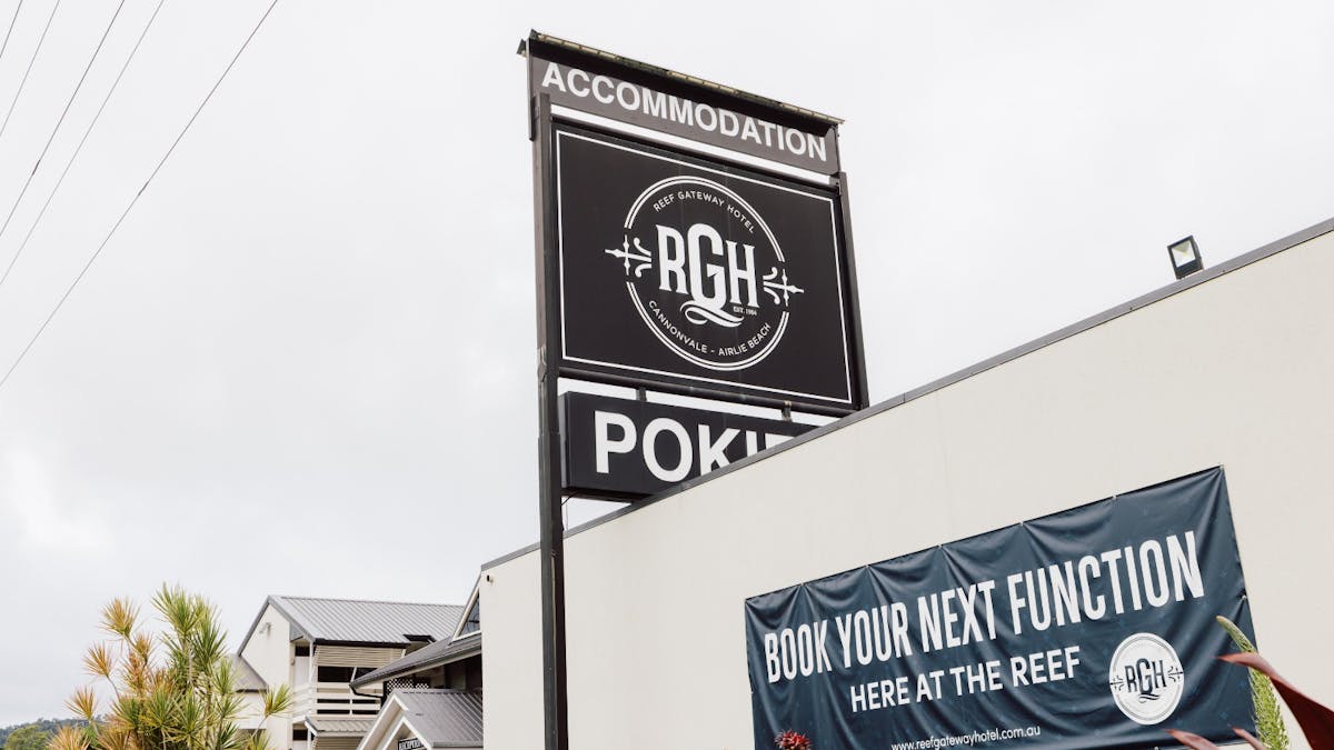 accommodation sign next door to the Reef Gateway Hotel bar and bistro