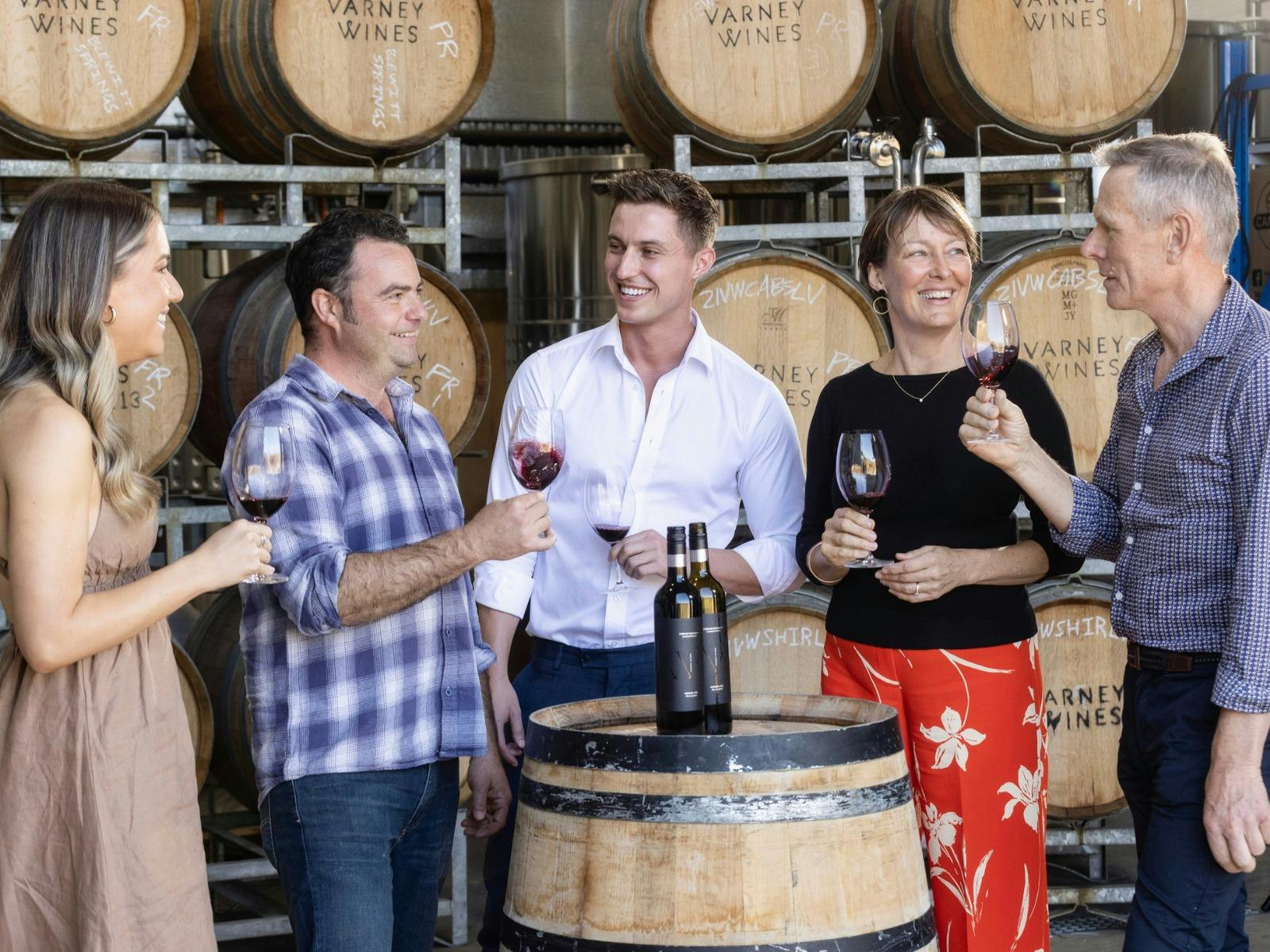 Winemaker and guests enjoying a wine tasting