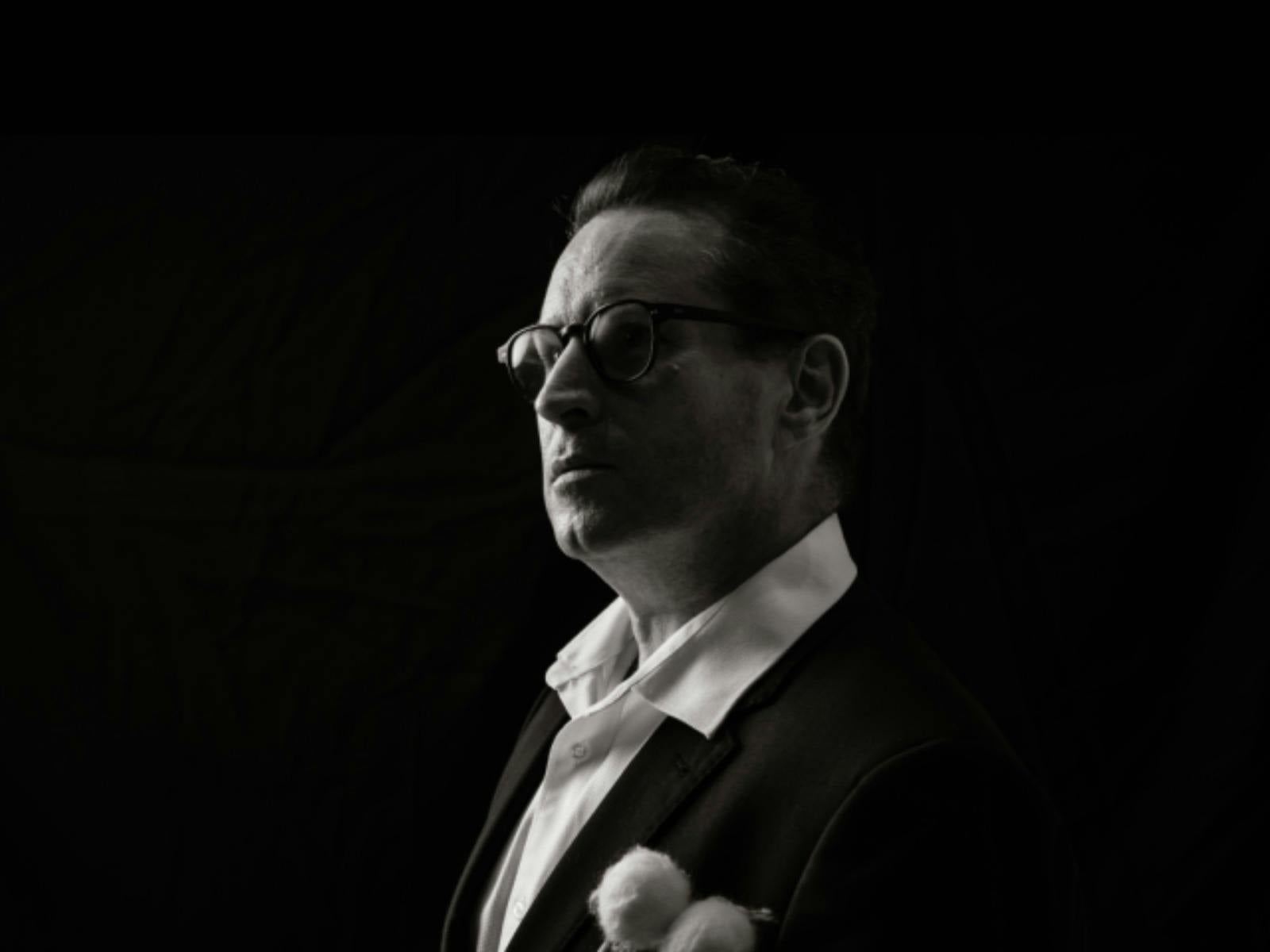 Black-and-white portrait of a timpanist in profile, looking toward the light Black-and-white portrait of a timpanist in profile, looking toward the light