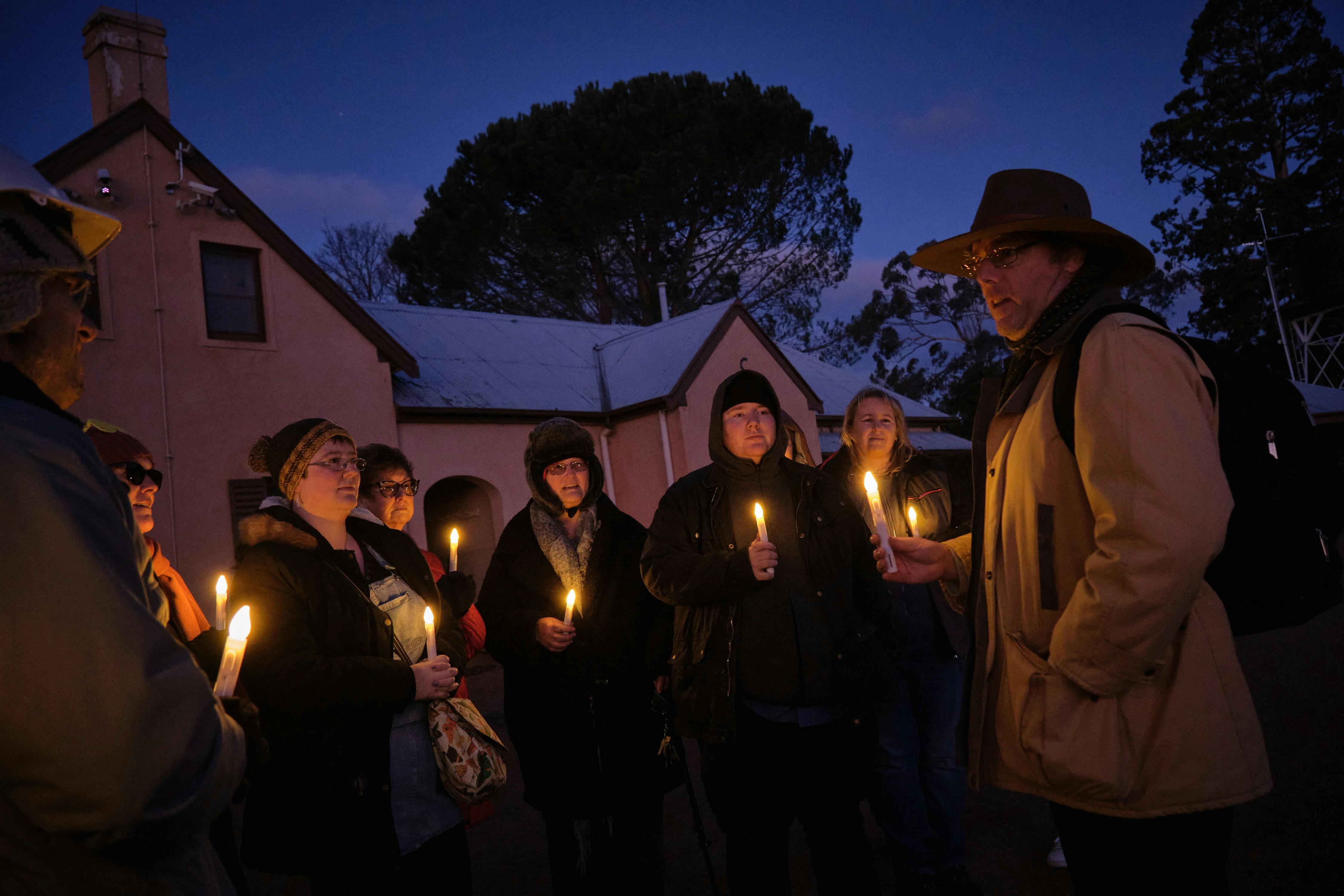 Tim the Yowie Man explaining something at Lanyon Homestead at dusk