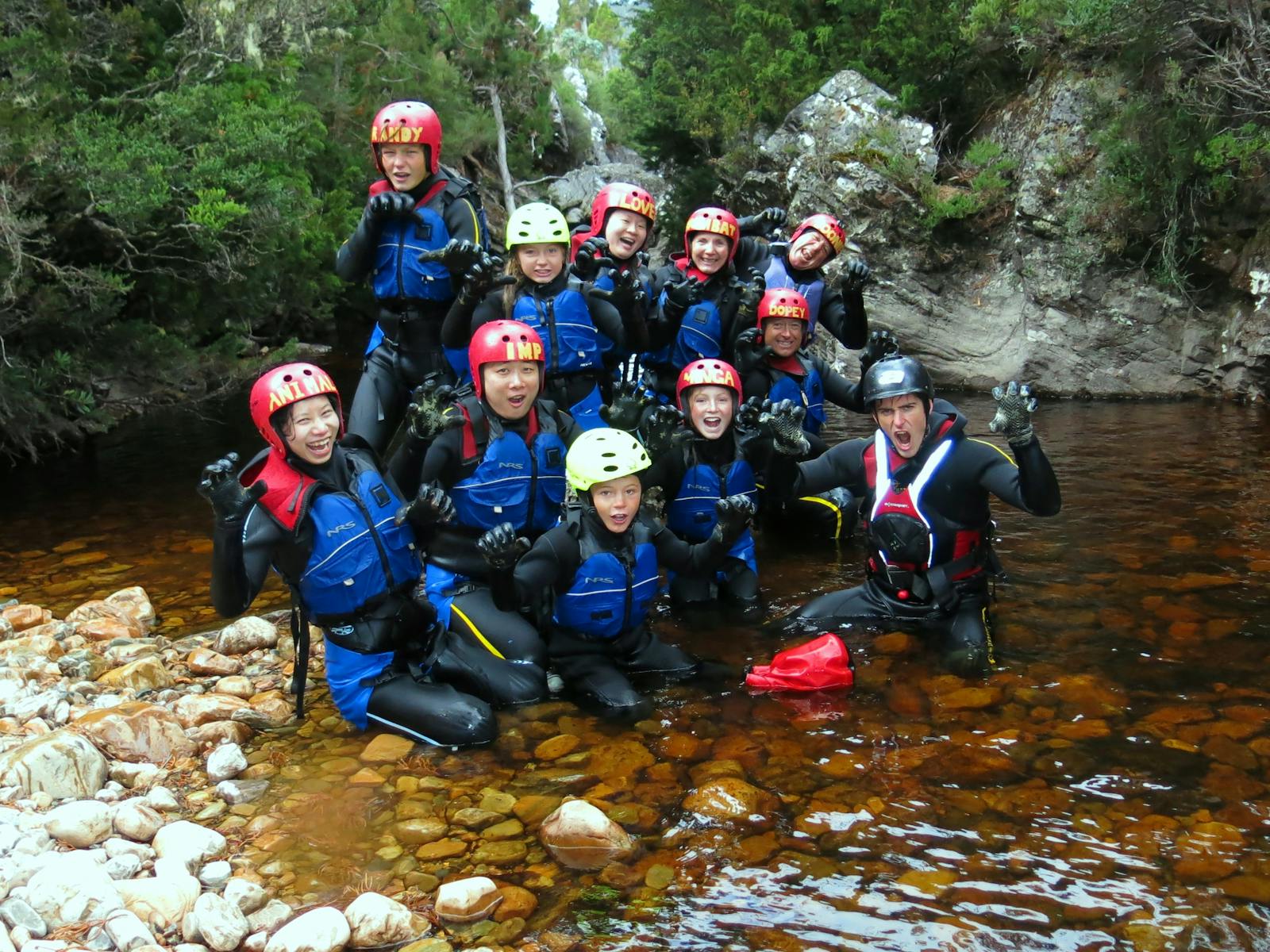 A group at the end of a canyoning tour at Cradle Mountain