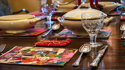 Historical Christmas objects laid out on dining table at Calthorpes House