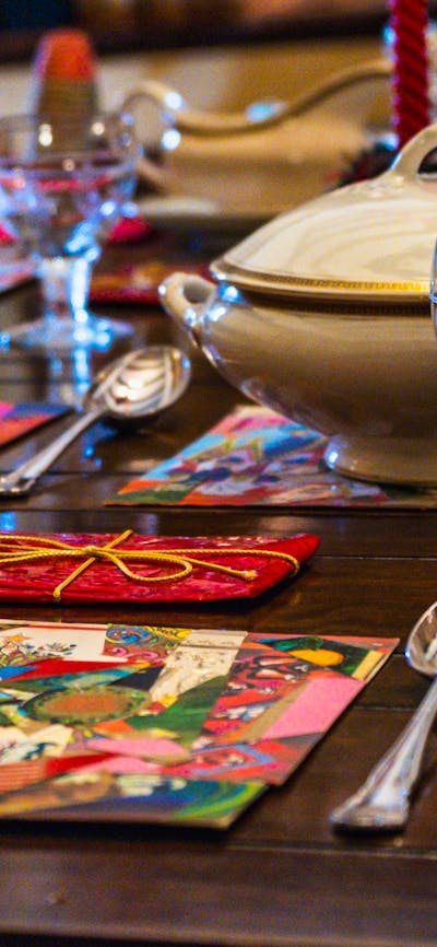 Historical Christmas objects laid out on dining table at Calthorpes House