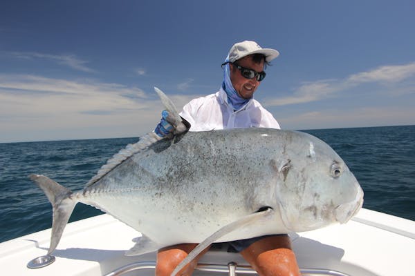 a really nice giant trevally caught and released on a surface lure.