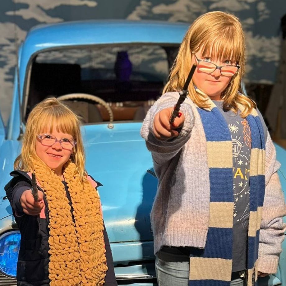 Two young witches holding new made wands
