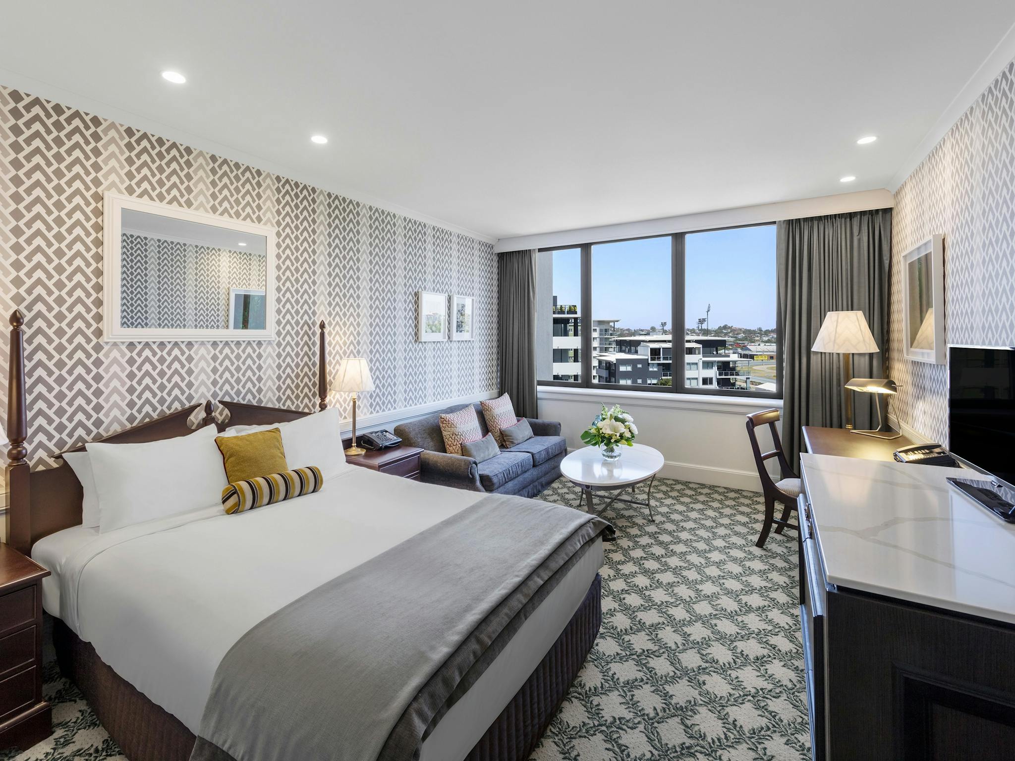 Hotel room with double bed and couch Hotel room with double bed and couch