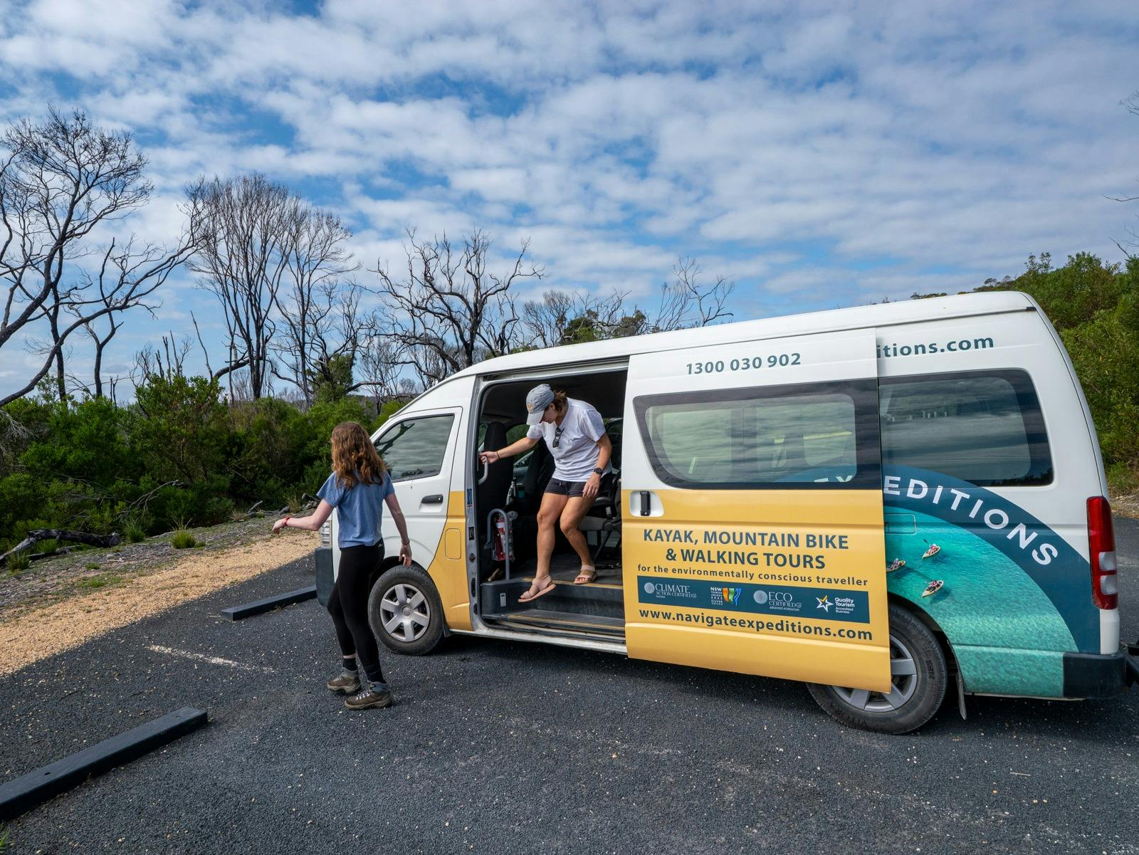 Guests disembarking from a mini-bus at the car park for Boyds Tower,  start of light to light walk