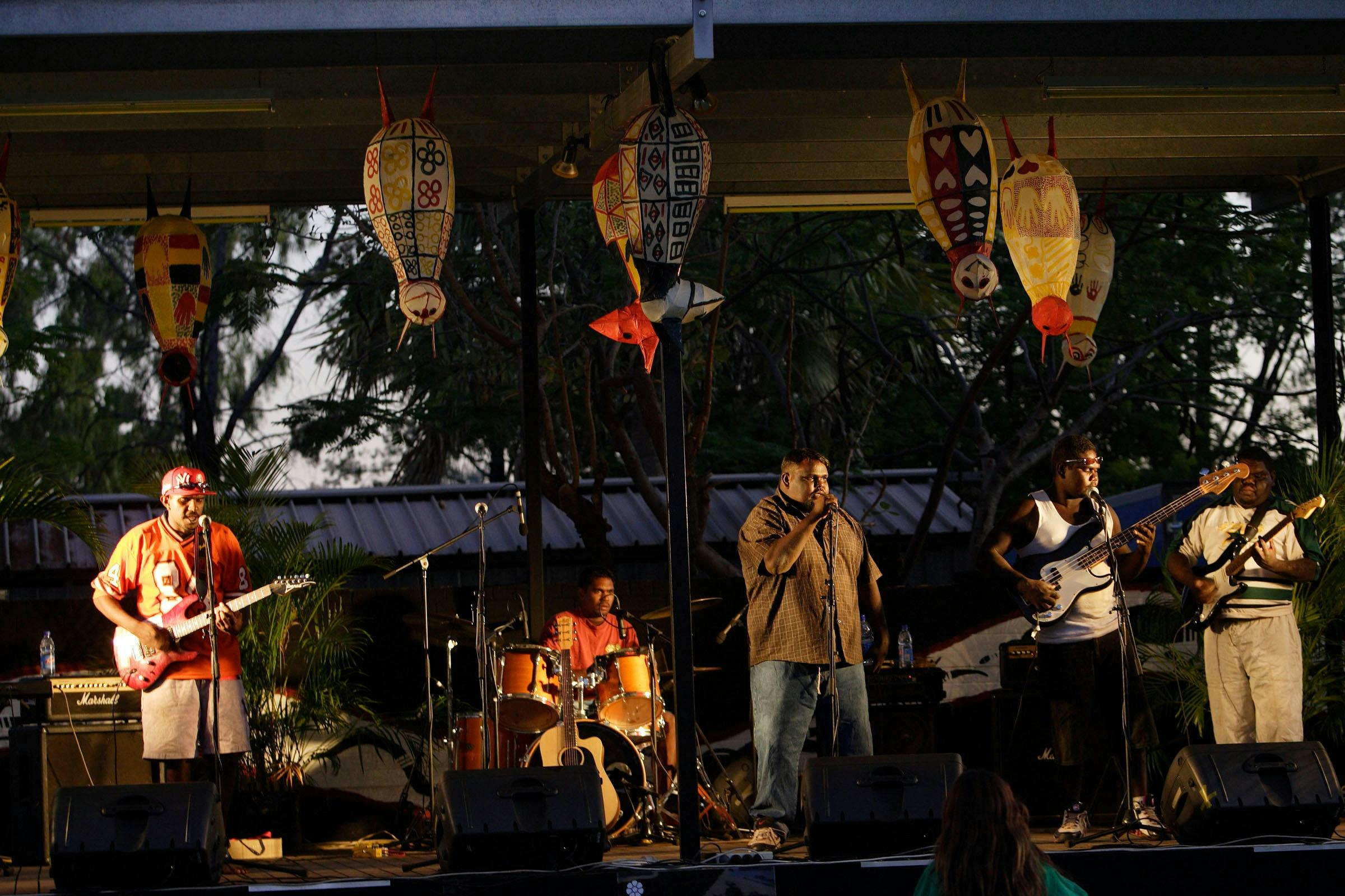 Performers singing on stage