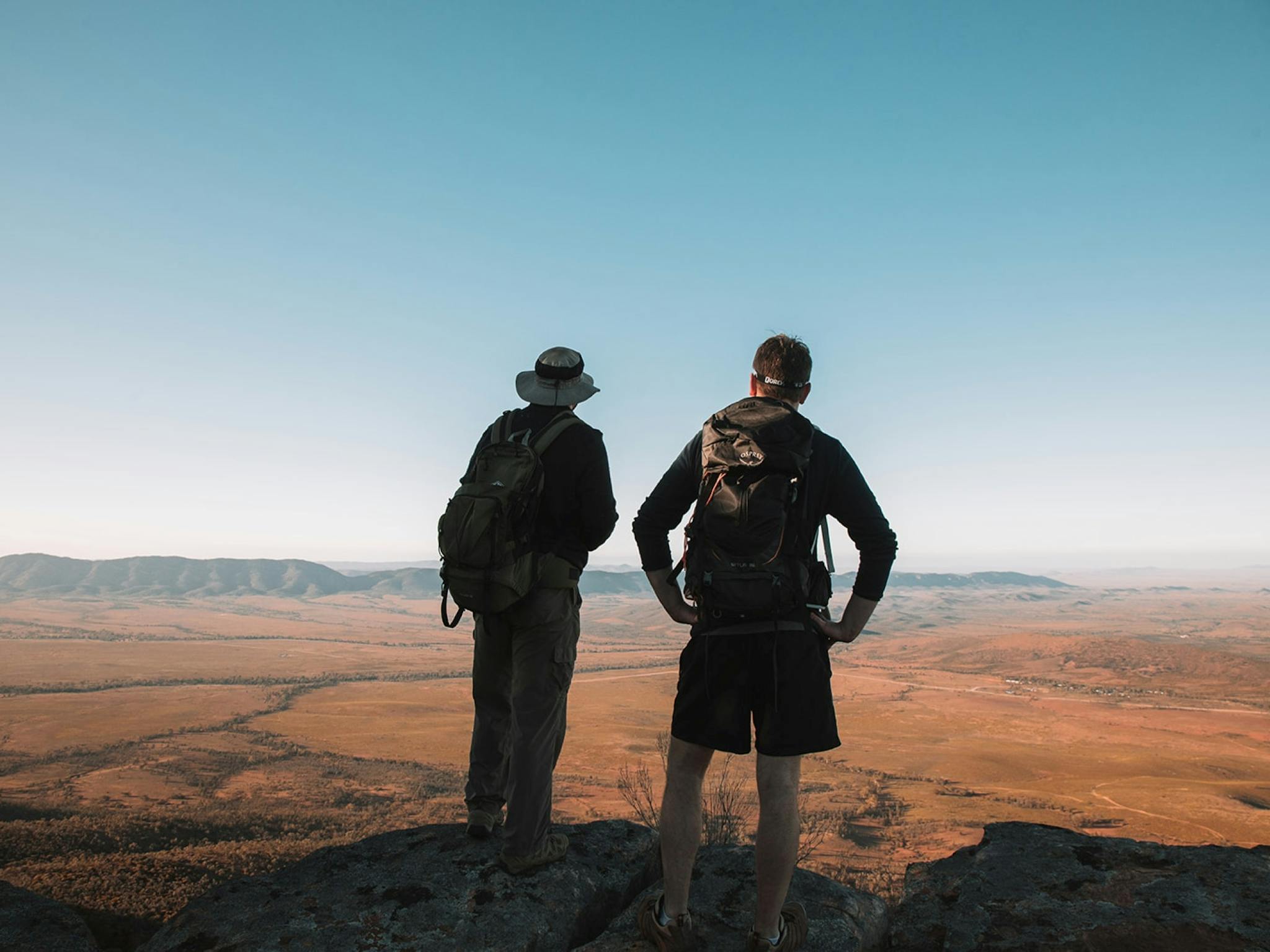Two people on a walking tour stopping to take in the view