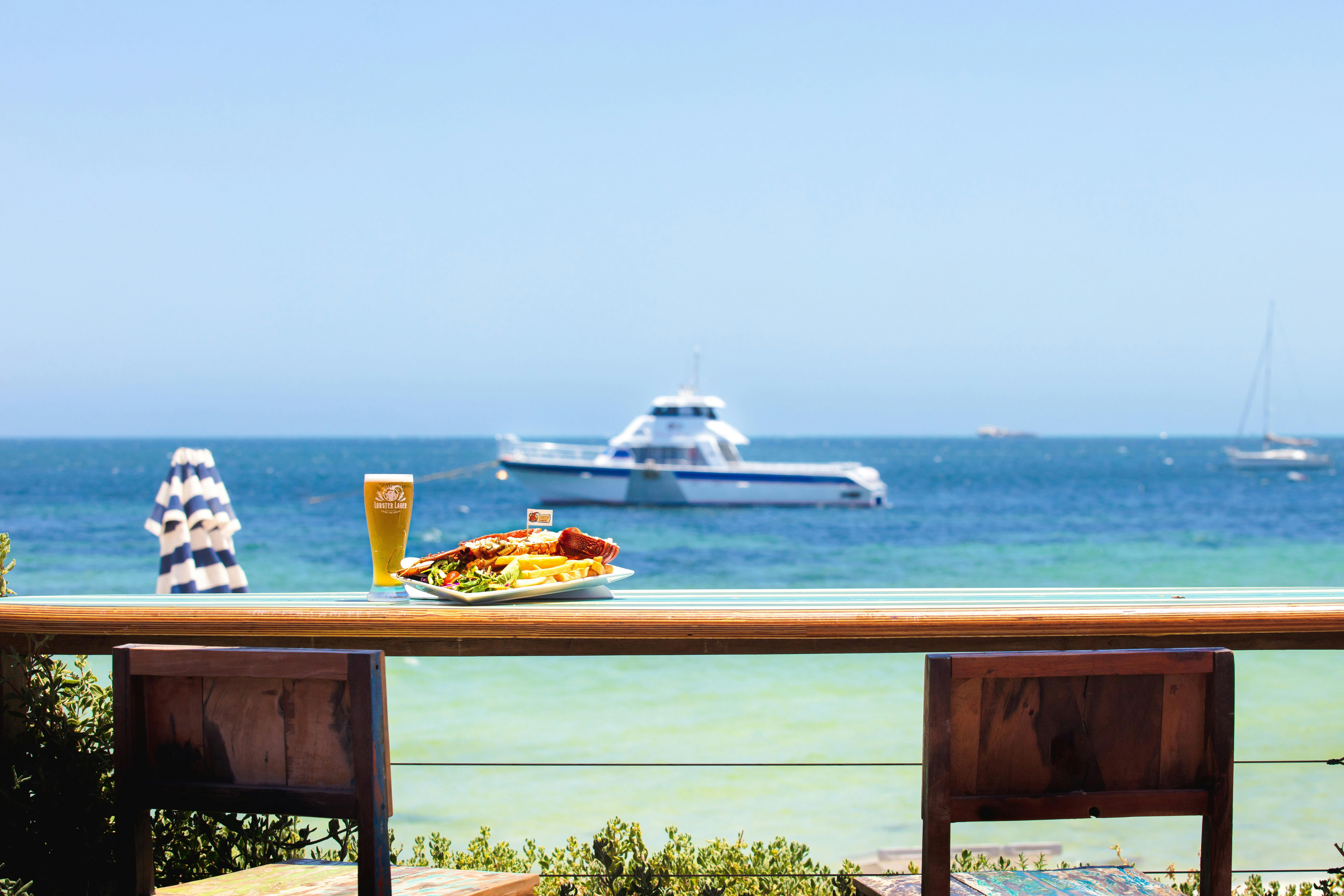 Front Deck with Lobster Meal and Tour Boat in the back ground