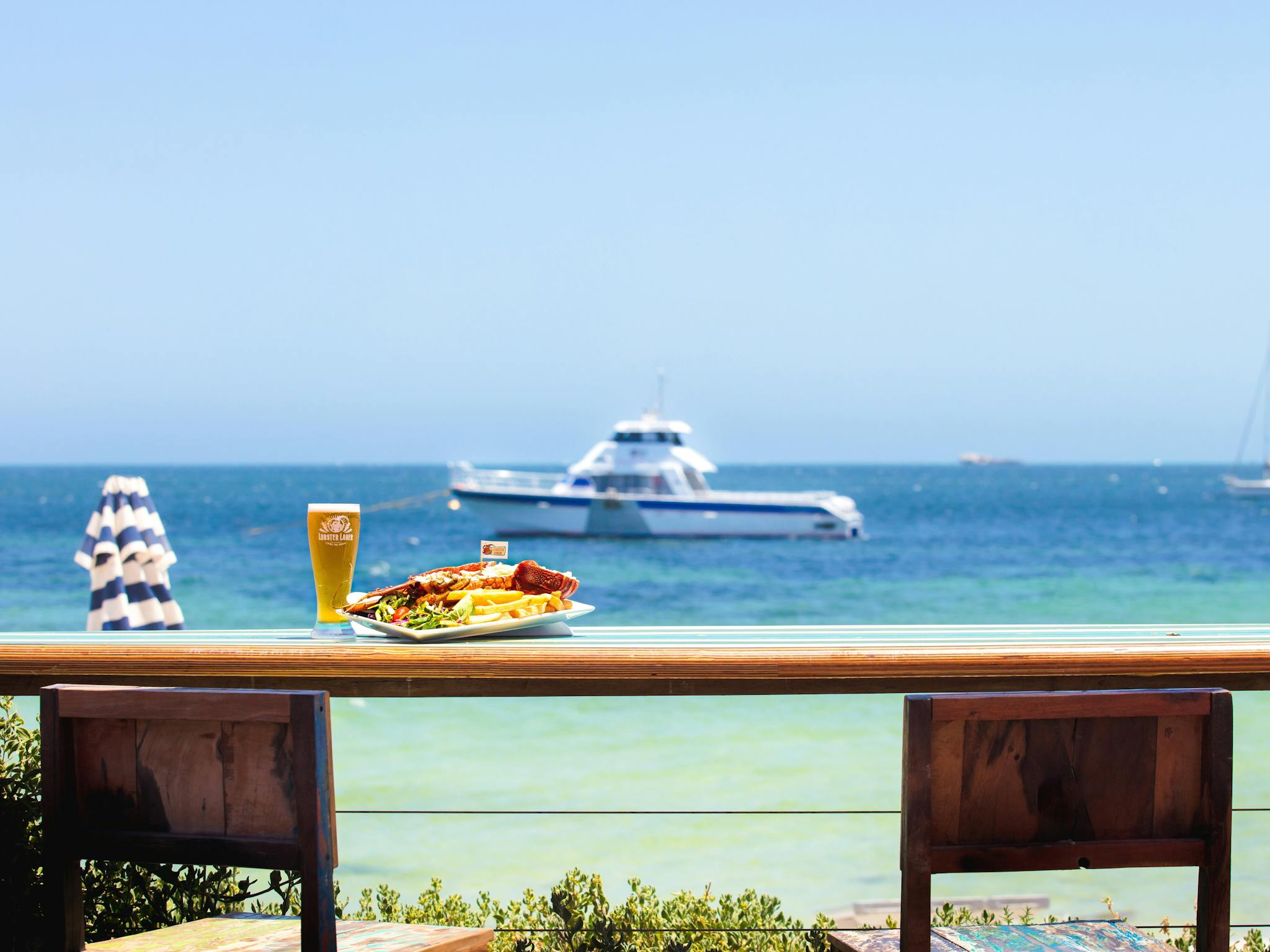 Front Deck with Lobster Meal and Tour Boat in the back ground