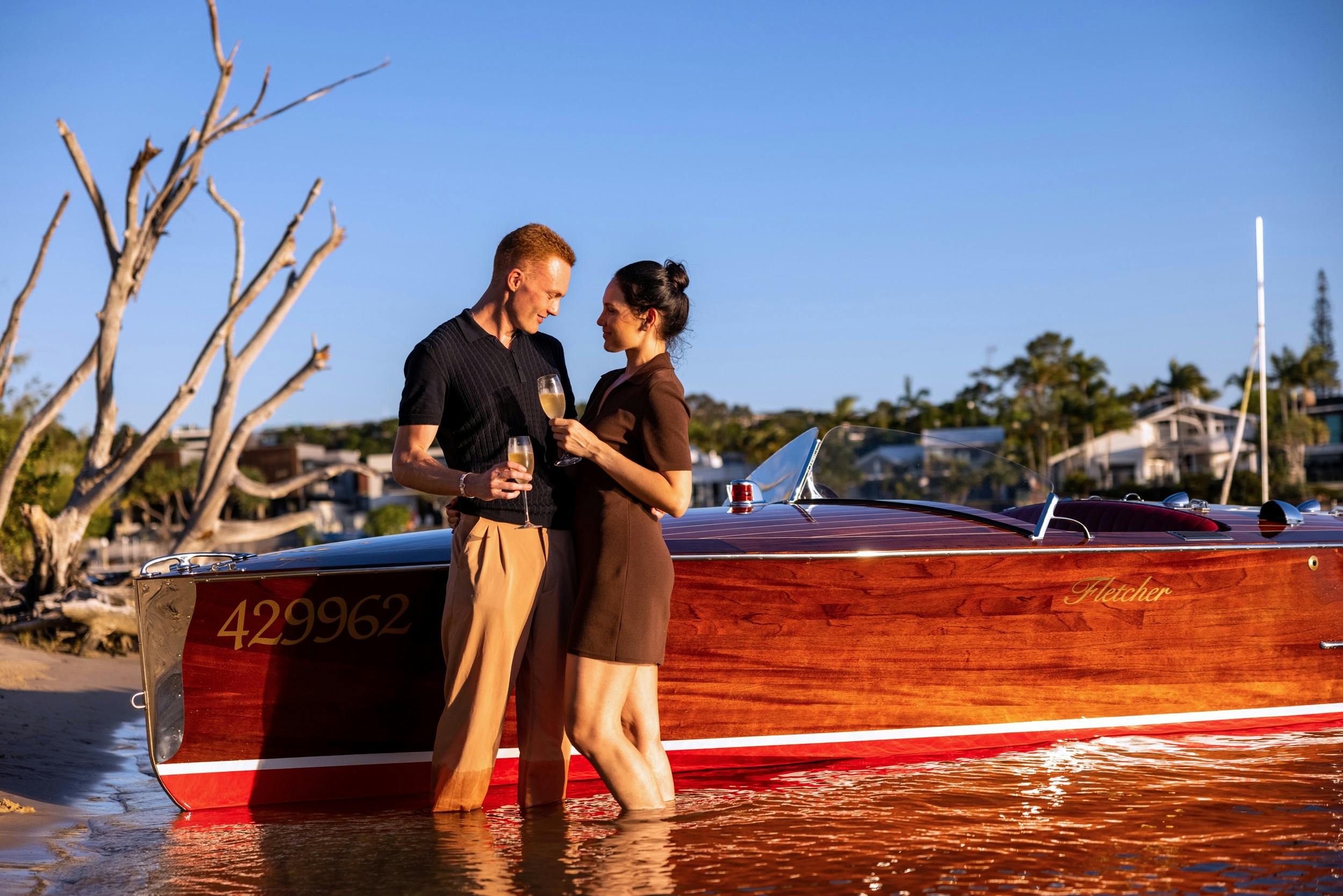 couple standing by the boat
