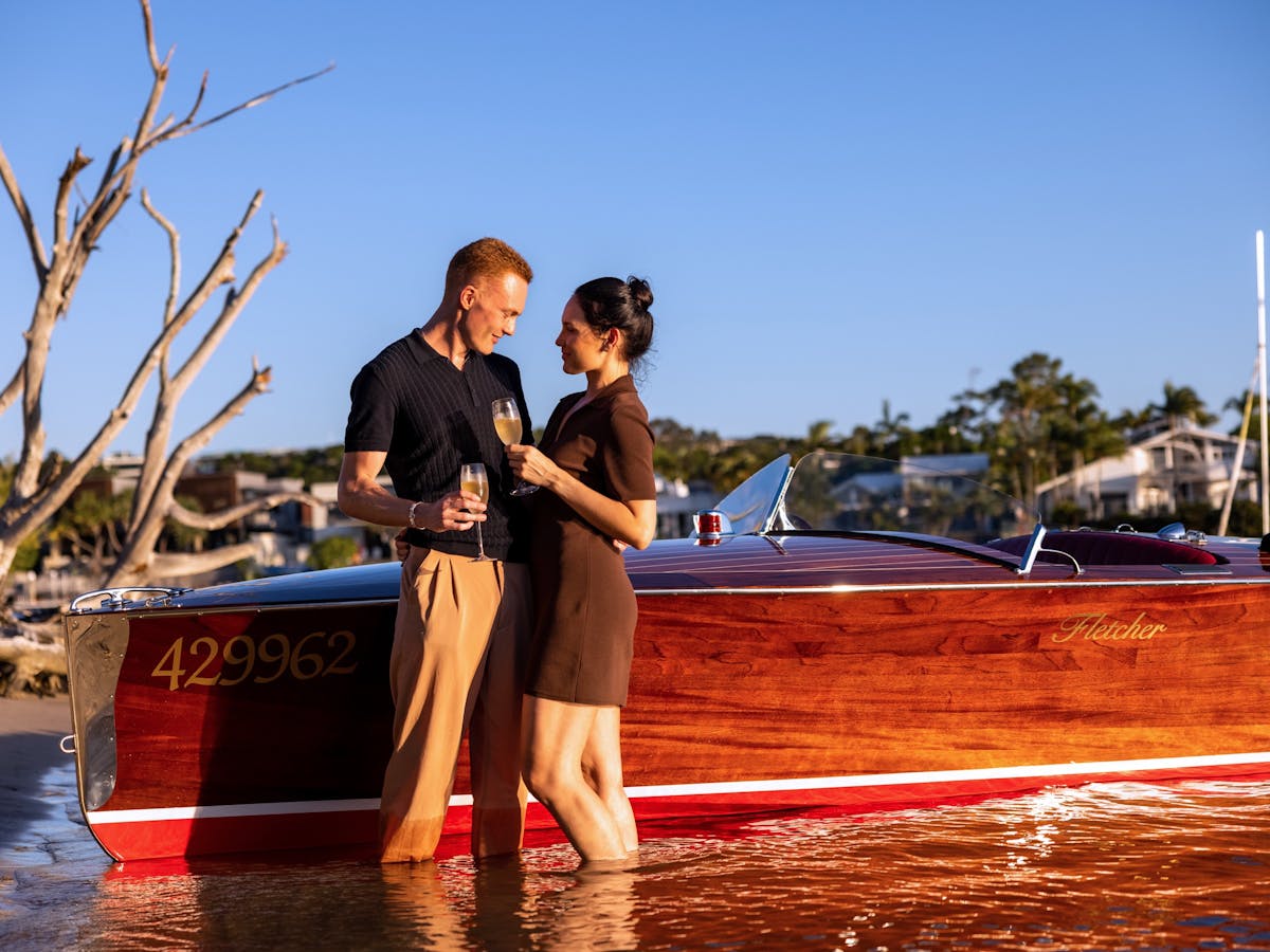 couple standing by the boat