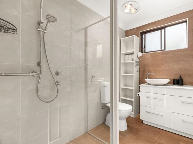 Main Bath - Shower, vanity and toilet.