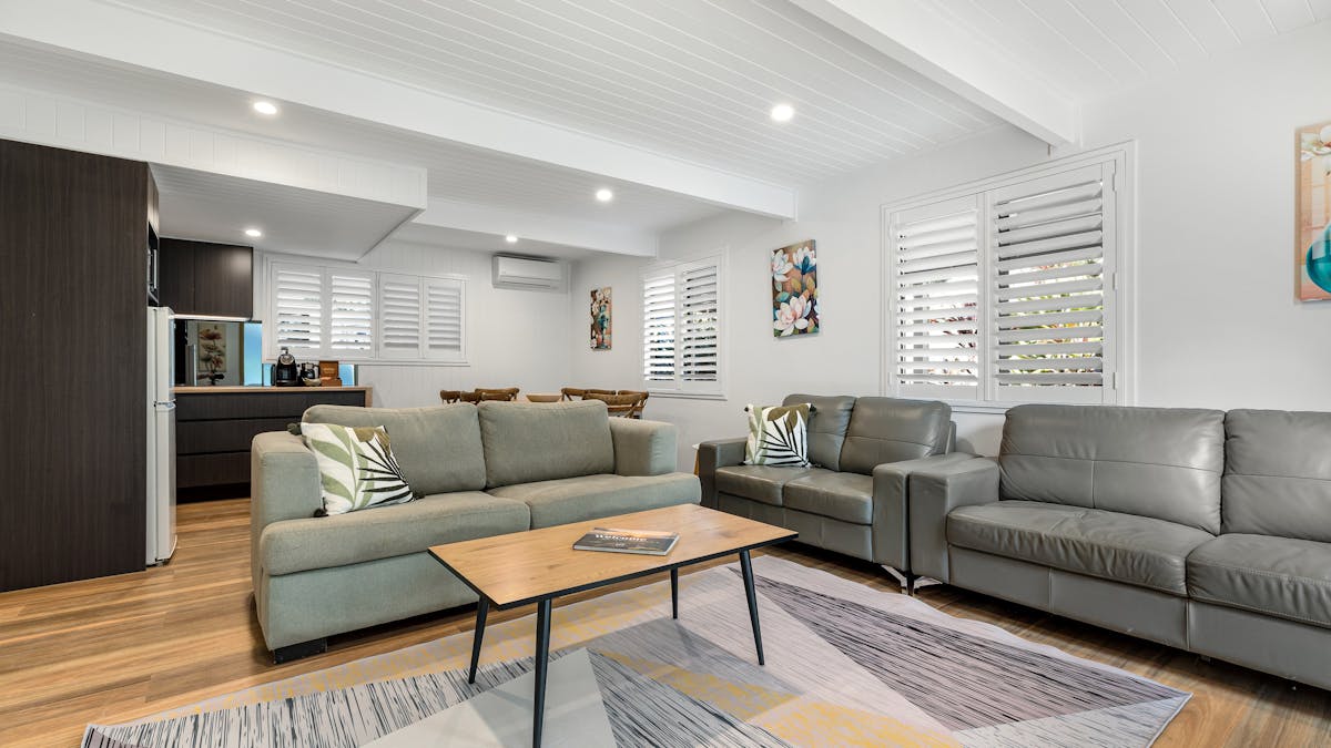 Image of living room of the Gingers House with coffee table and couches