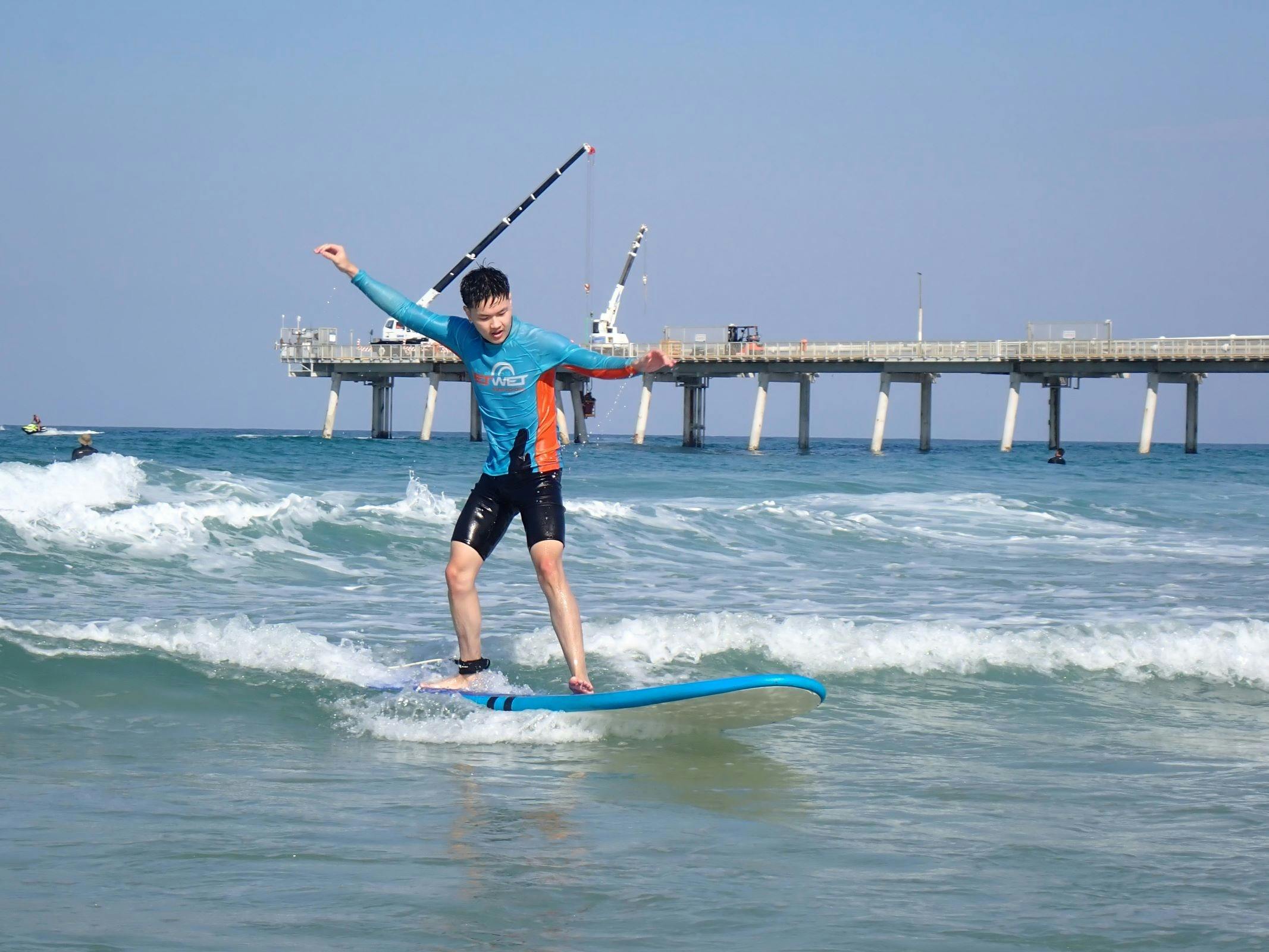 Surfer riding wave, Get Wet surf School, Gold Coast