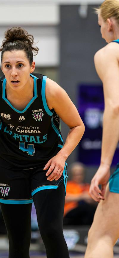 Basketball player bounces the ball.