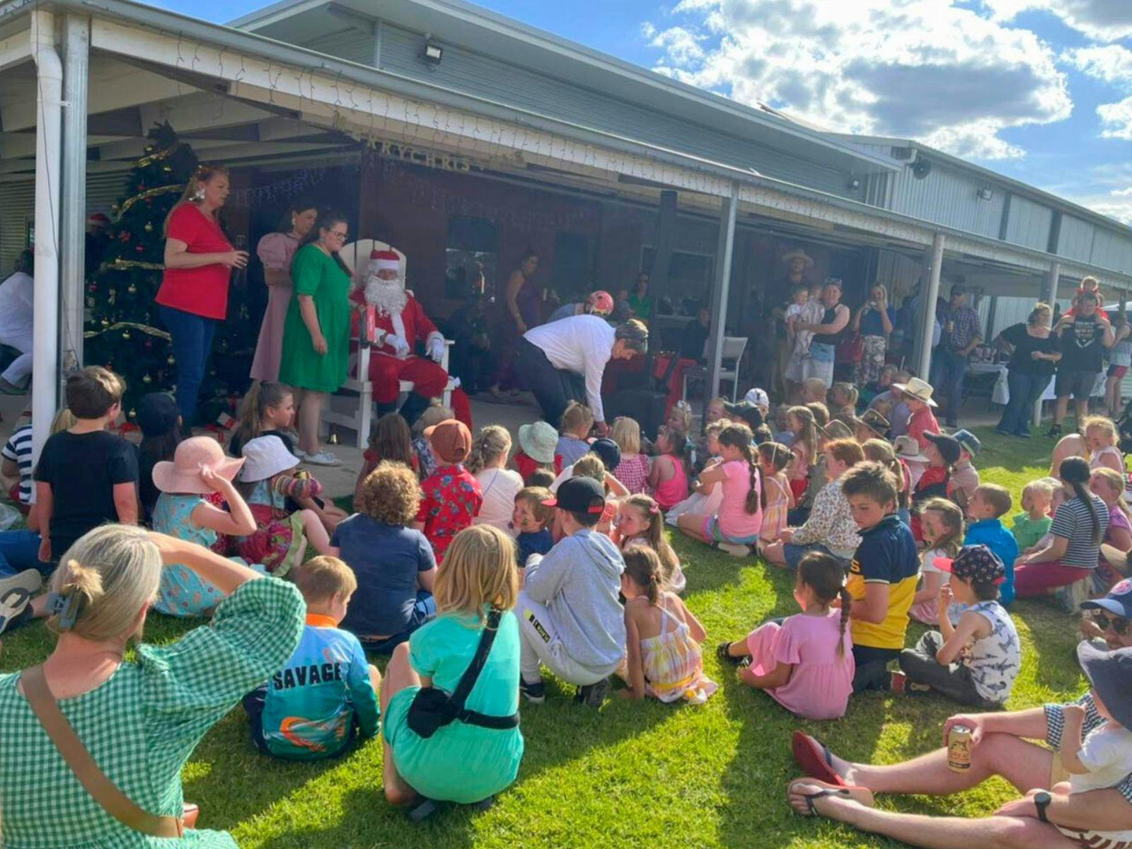 children sitting in front of Santa