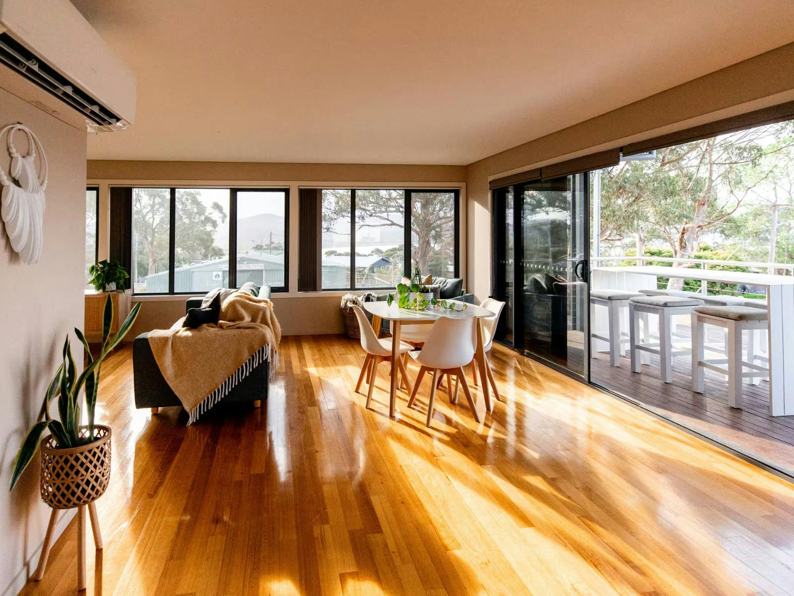 Open living and dining area at Binalong Bay Beach House, Tasmania.