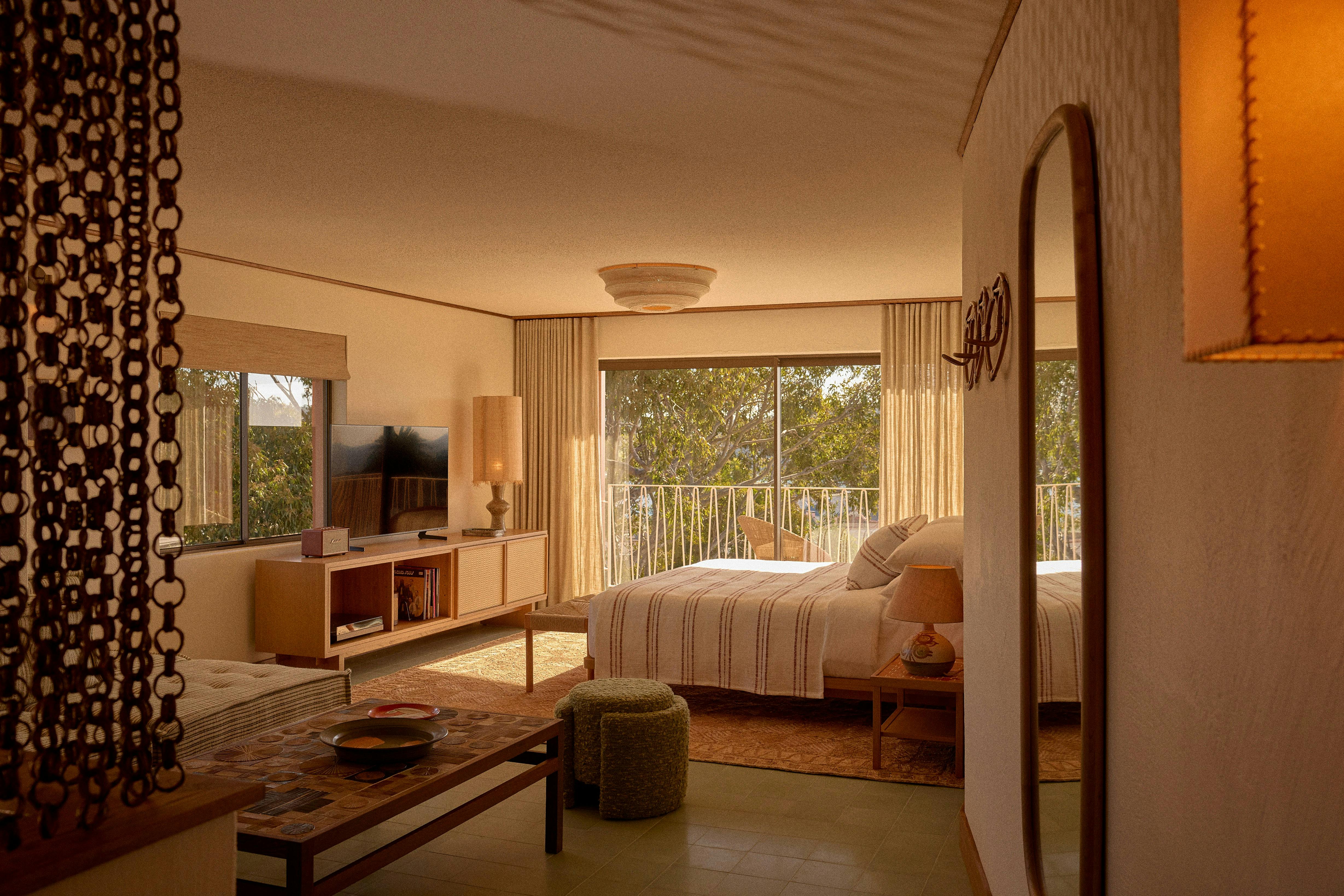 Bedroom with bed, mirror and TV