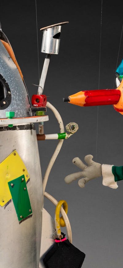A puppet of a rocket ship and Mr Squiggle