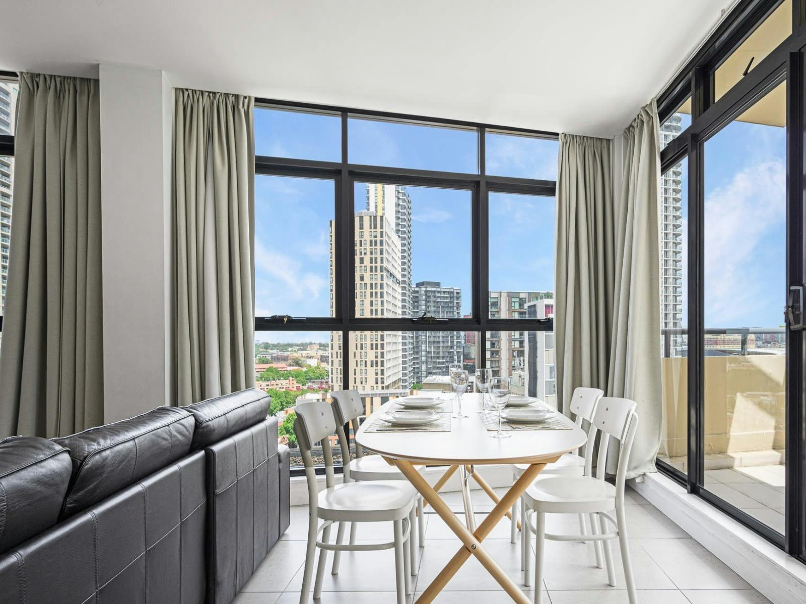 Dining space with balcony access and natural light.