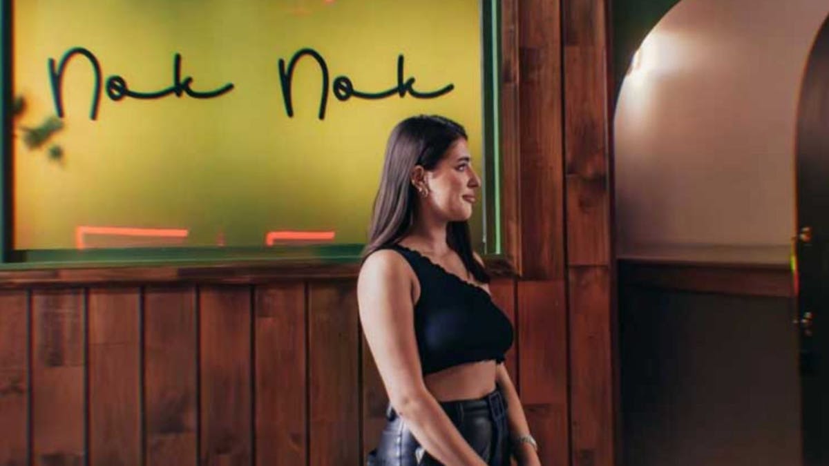 Hostess standing at entrance of Nok Nok